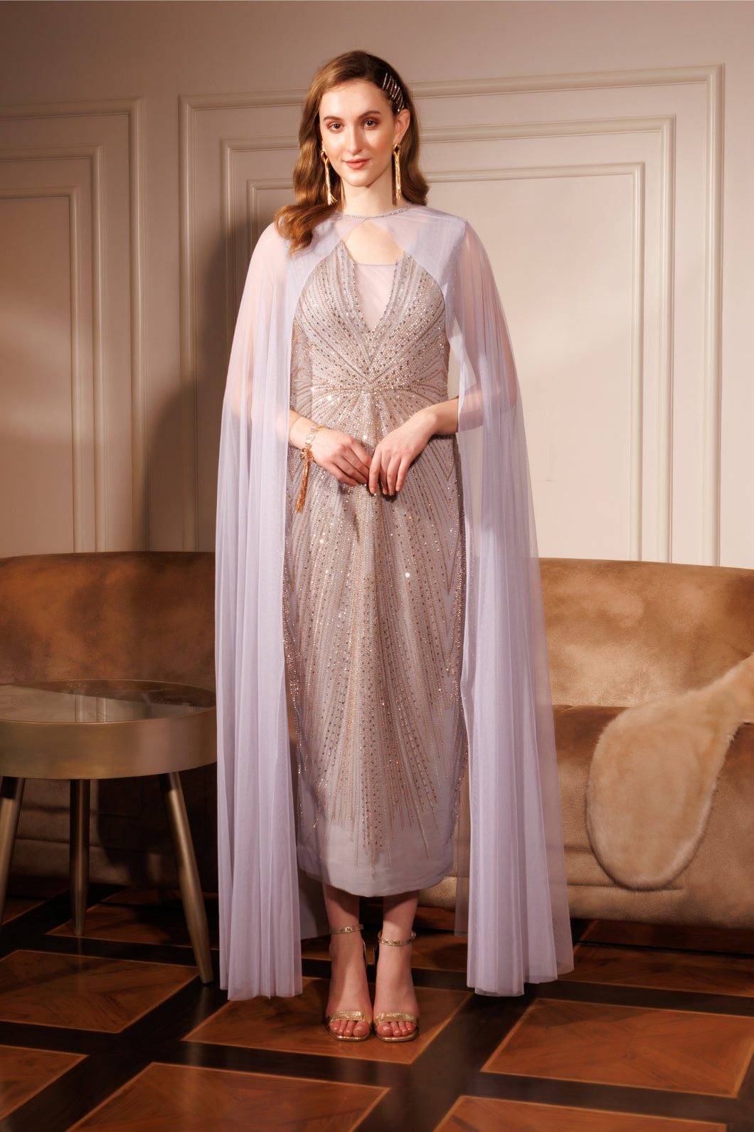 Embroidered gown with sheer cape